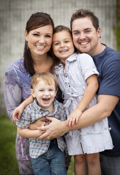 Mother father and children smiling after family dentistry visit