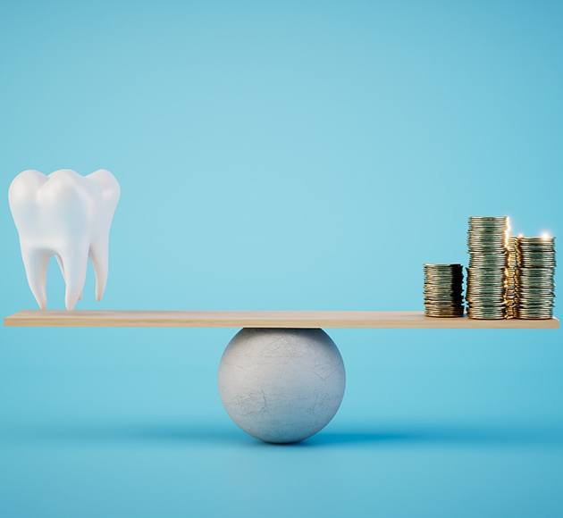 A balance beam holding a 3D model tooth and a pile of gold coins 