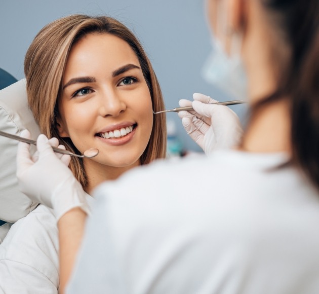 Woman smiling during dental exam