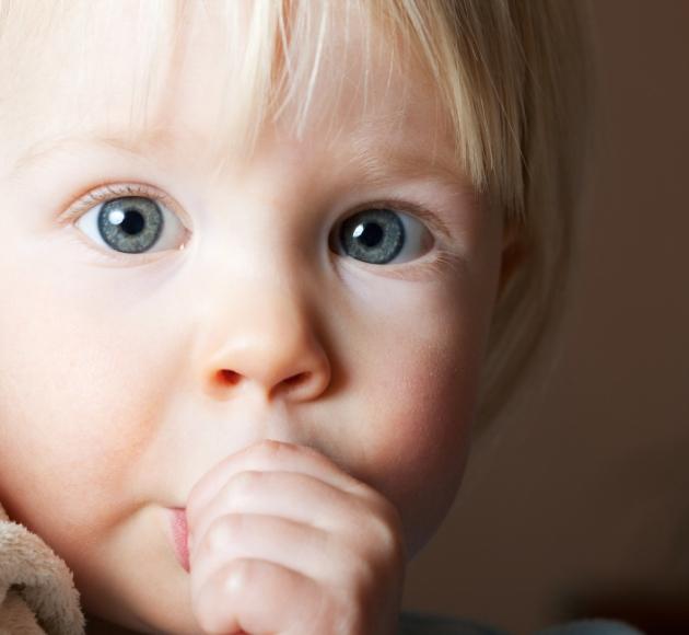 Child sucking their thumb