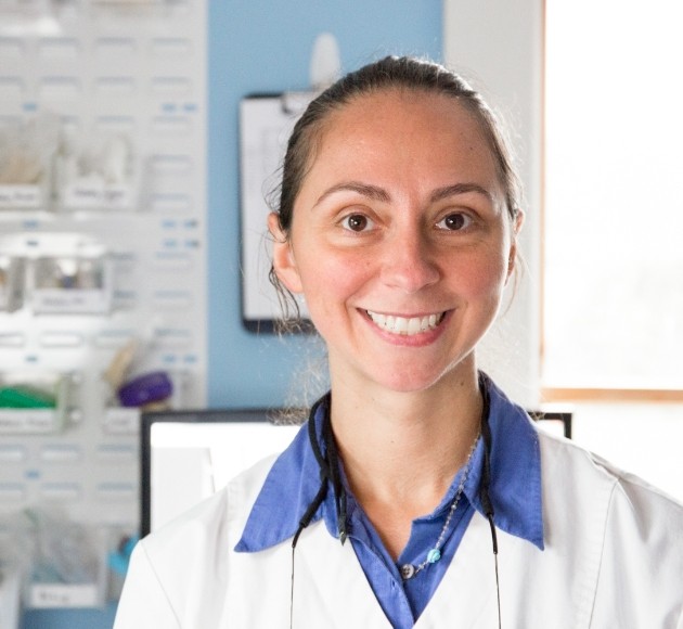 Doctor Papageorgiou smiling in the dental office