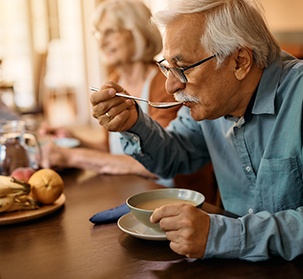 Your diet following dental implant surgery should include soft foods like soups and mashed potatoes