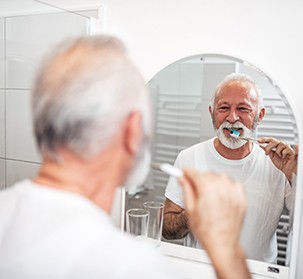 You can brush your teeth as usual the day after your dental implant surgery but be careful around your implant sites