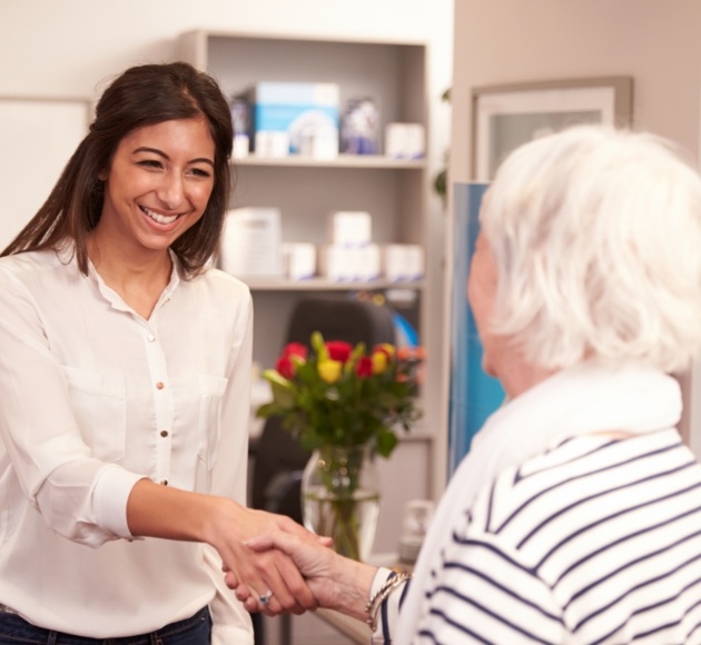 Dentist and patient discussing the cost of dental implants