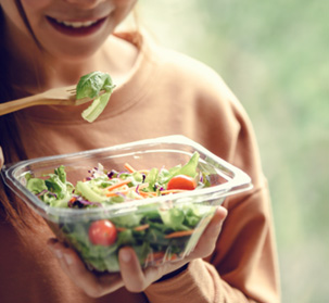 a person eating a salad