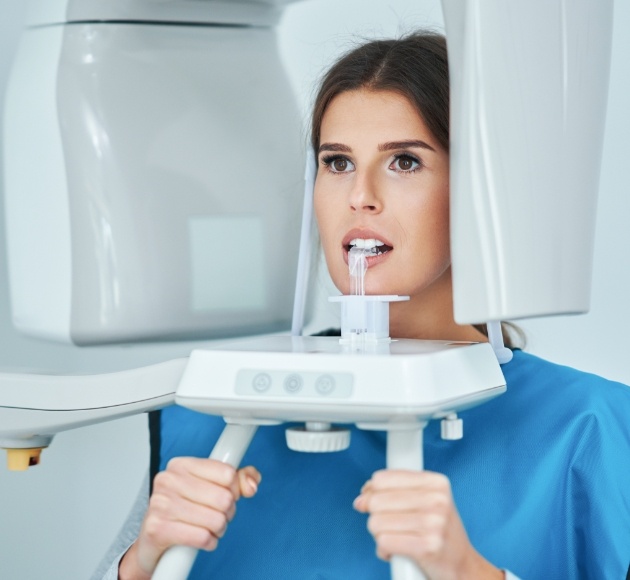 Woman receiving digital x-ray scans