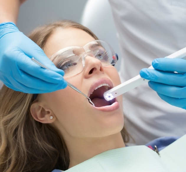 Dentist using intraoral camera to capture smile images