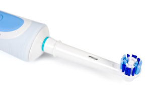 white electric toothbrush as recommended by a dentist