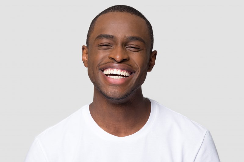 young man smiling and laughing