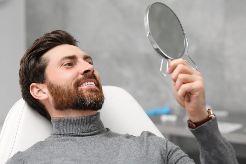 Man smiling after his fluoride treatment